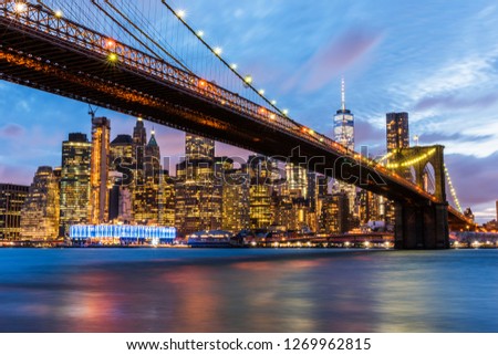 Brooklyn Bridge with skyscrapers background. New York City, USA. Brooklyn Bridge is linking Lower Manhattan to Brooklyn.
