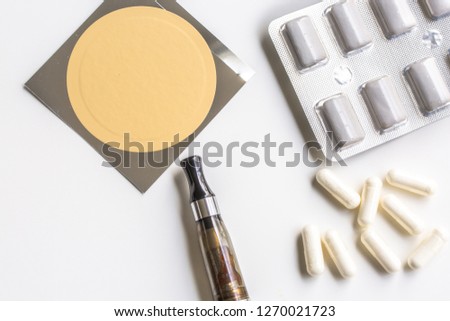nicotine patch, chewin gum and ecigarette used for smoking cessation isolated on white background Royalty-Free Stock Photo #1270021723