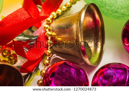 Closeup view of many beautiful old fashioned golden christmas bells hanging as new year toys, horizontal picture
