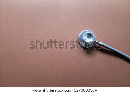copy space and Flat lay , top view stethoscope on brown background space for text