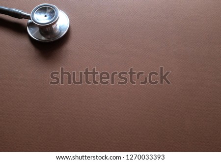 copy space and Flat lay , top view stethoscope on brown background space for text