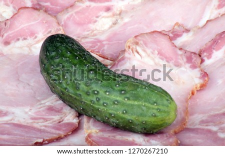 cucumber on ham meat  background