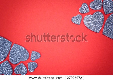 Valentine's Day, silver hearts in the shape of a heart on a red background,  modern