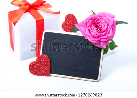Valentine's Day, silver and red hearts on a white background with empty space, copy space