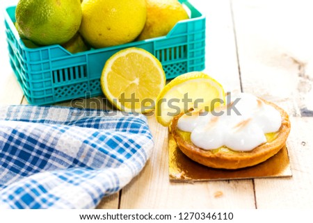 Meyer Lemon Tartlets with Lemon Curd on cutting board