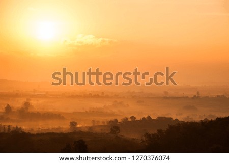 Beautiful morning mist and sunrise over the mountain in Thailand