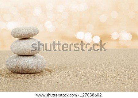 Balance zen stones in sand on white background Royalty-Free Stock Photo #127038602