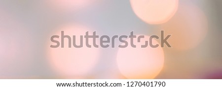 Beautiful elegant pastel multicolor color holiday background for Christmas New Year Birthday Valentine celebration. Big golden garland bokeh lights soft glow. High resolution long banner