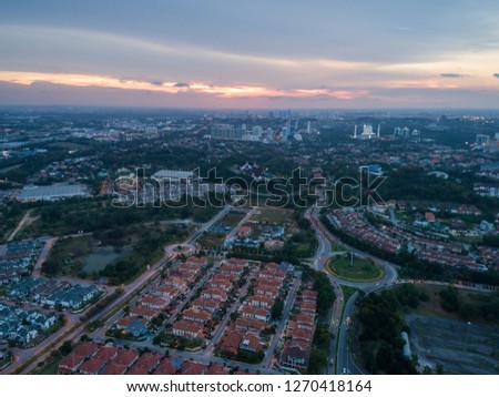 Aerial view of Shah Alam city during sunset with Sultan Salahuddin Abdul Aziz Mosque in background