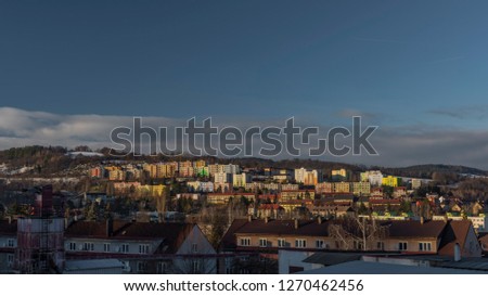 Vimperk town and block of flats in cold winter evening in sunset time with snow and ice