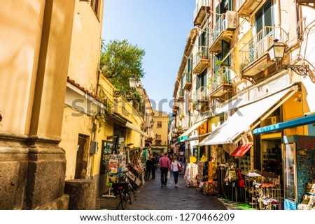 Couple walking on the narrow streets of Sorrento, Italy. Local shops in Sorrento. Royalty-Free Stock Photo #1270466209