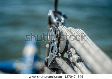Beautiful boats, sail ships and rigging. Beautiful background and view, landscape and panorama of sails, rigging, steering wheels, ropes on sailboats in the summer and on a sunny day.