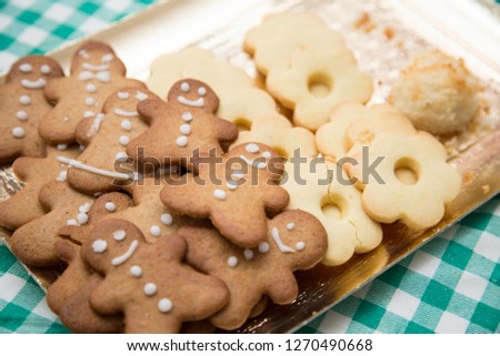 horizontal image with detail of a tray with nice Christmas cookies