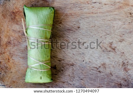 "Bollo", a traditional recipe from Panamanian cuisine. There are a variety of "bollos" in Panamanian cuisine. The  picture shows one made from corn dough wrapped in Calathea lutea (bijao) leaves.  