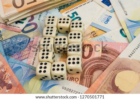 Brexit. Dice lying on the banknotes.