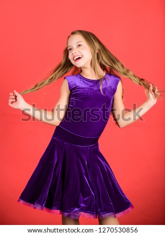 Hairstyle for dancer. How to make tidy hairstyle for kid. Ballroom latin dance hairstyles. Kid girl with long hair wear dress on red background. Things you need know about ballroom dance hairstyle.