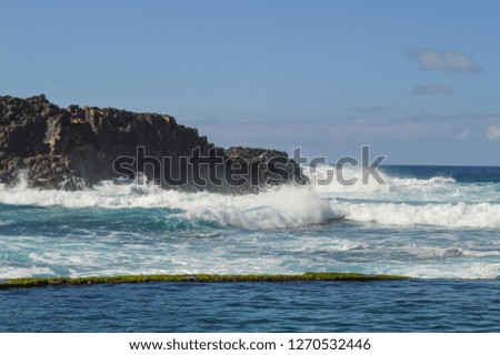 Atlantic Ocean beach with waves and blue water.