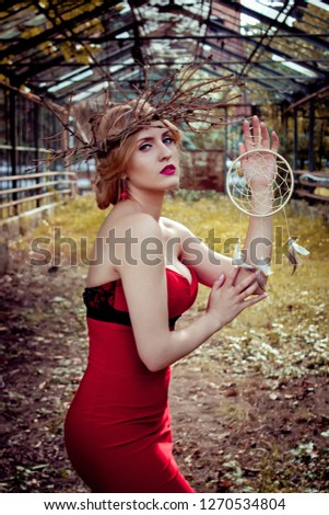 girl in red dress with dream catcher