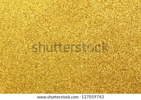 Detailed texture of glittering golden dust surface Royalty-Free Stock Photo #127059743
