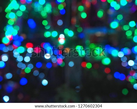 Red blue green bokeh abstract background for background merry cristmas and happy new year.