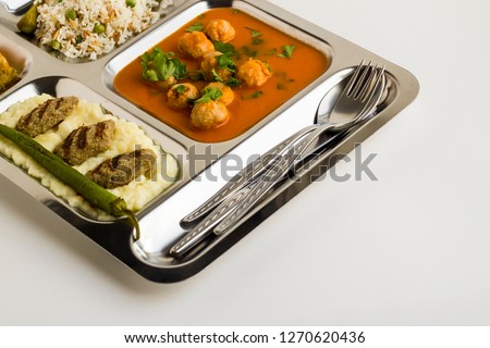 Traditional Turkish,meatballs soup,rice,mashed potatoes,grilled meatball stainless steel food tray.Table d'hote or known Tabldot in TR Royalty-Free Stock Photo #1270620436