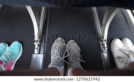 Interior view of a commercial airplane and its legroom in between seats. Royalty-Free Stock Photo #1270621942