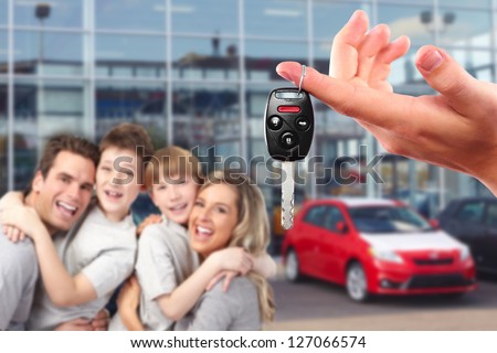 Happy family with a new car. Driving and transportation concept.