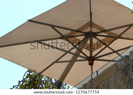 umbrella on the beach from rain and sun
