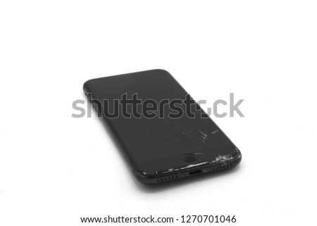 smart phone with broken screen, Broken screen cell phone on gray background. Smartphone Insurance and Mobile phone warranty concept. top view.