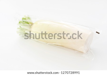 Japanese white radish in Plastic bag on white background