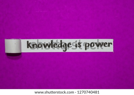 Knowledge is power, Inspiration, Motivation and business concept on purple torn paper