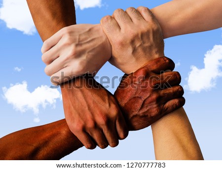 multiracial group with black african American Caucasian and Asian hands holding each other wrist in tolerance unity love and anti racism concept isolated on blue sky background