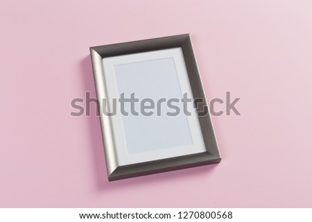 silver frame on pink background
