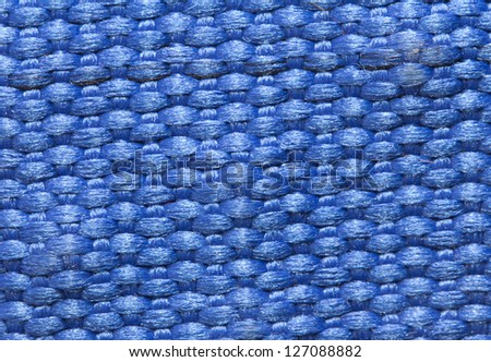 background of blue fabric. Macro