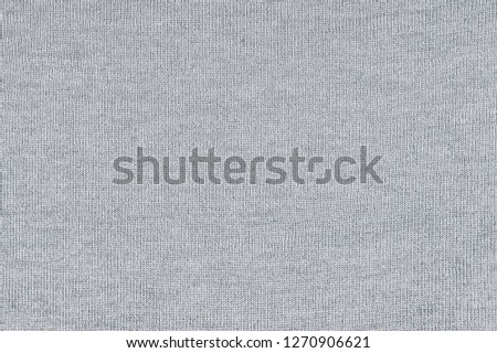 Knitted gray background texture of fabric