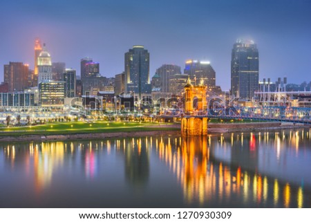 Cincinnati, Ohio, USA skyline on the river at night.
