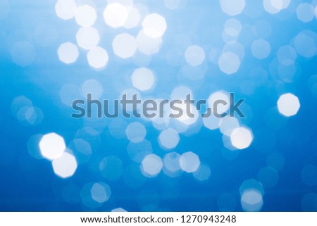 Defocused blue background with bokeh lights