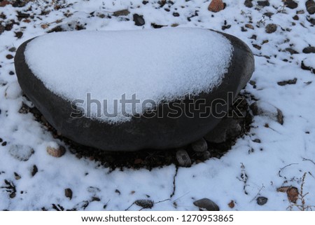 stone covered with snow . winter time 

