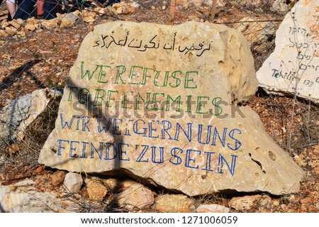 We refuse to be enemies, Wir weigern uns Feinde zu sein, on rock in Palestine, Westbank - Israel