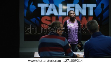 The girl is crying in front of the jury due to the fact that she is not accepted in the show.