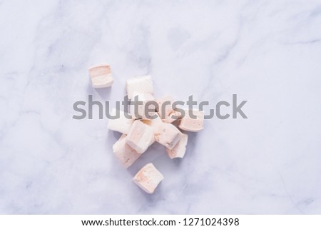 Flat lay. Marshmallow cubes with chocolate flavor for hot cocoa toppings.