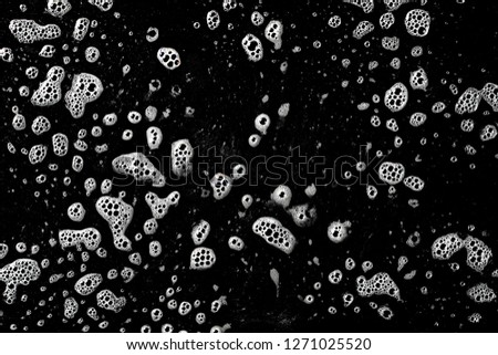 Soap foam isolated on black, with clipping path, texture and background, top view