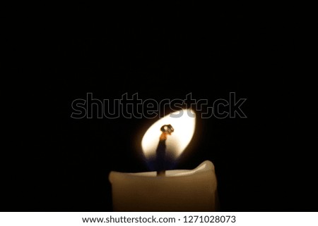 Beautiful Candlelight and nice black background,Burning candle on a black background,candle light isolated black