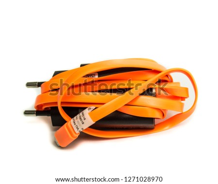 Black phone charger. USB cable. Orange charger cable