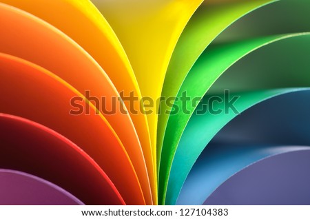 Abstract rainbow background with colored paper.Dark tones.