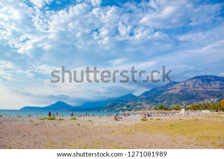 sunny summer day , people relaxing on the beach 