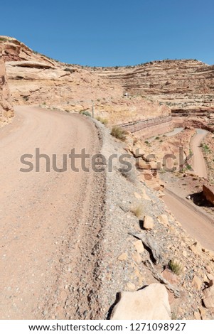 Typical road in Utah is a staggering, graded dirt switchback road carved into the face of the cliff edge of Cedar Mesa. 
