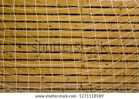 sports mesh on a wooden wall background