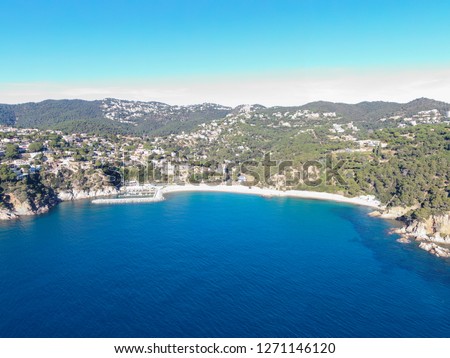 Aerial view of Cala Canyelles beach in Lloret de Mar taken with drone