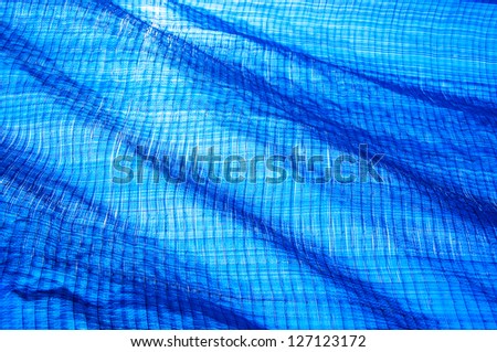 the blue lighting net use for cover the construction area to protect dusk.